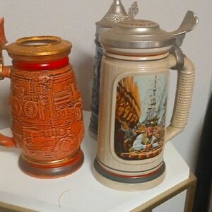 Vintage Beer Steins with Intricate Designs
